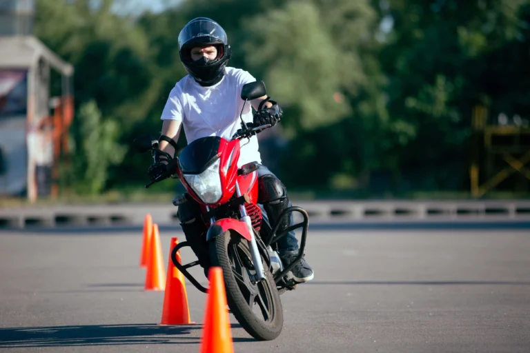 Motorcycle riding school student developing skills in beginner motorcycle course